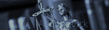 A statue of lady justice holding up a sword.